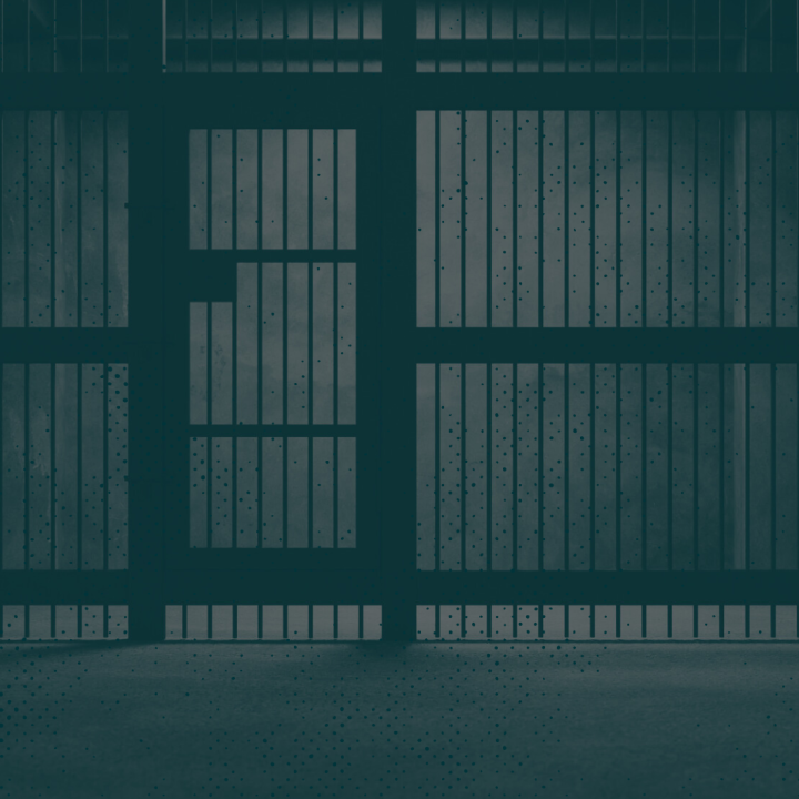 Image of jail cell with a green monochromatic overlay. 